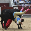 El diestro Ginés Marín sufre un revolcón con su primero de la tarde durante la corrida de la Feria de San Isidro del domingo 15 de mayo en la plaza de Las Ventas, en Madrid.