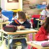 Alumnos en su clase del CEIP Trajano de Mérida