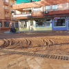 Calle embarrada tras el paso de la tormenta