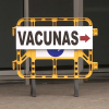 Cartel indicativo en la vacunación masiva