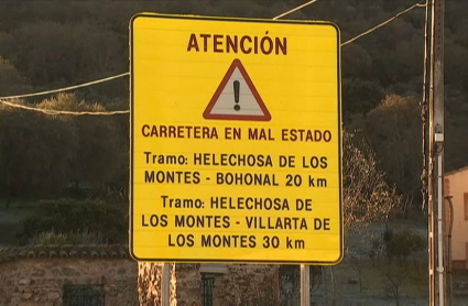 Cartel advirtiendo del mal estado de los caminos en la 'Y del Cíjara'